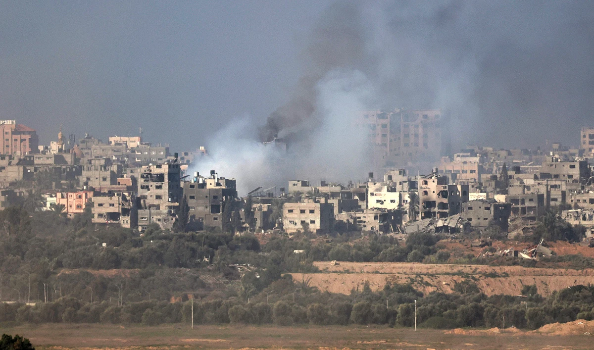 This picture taken from the Israeli border with the Gaza Strip shows smoke billowing over central Gaza following Israeli strikes on December 31, 2023, as battles continue between Israel and the Hamas movement. (AFP)