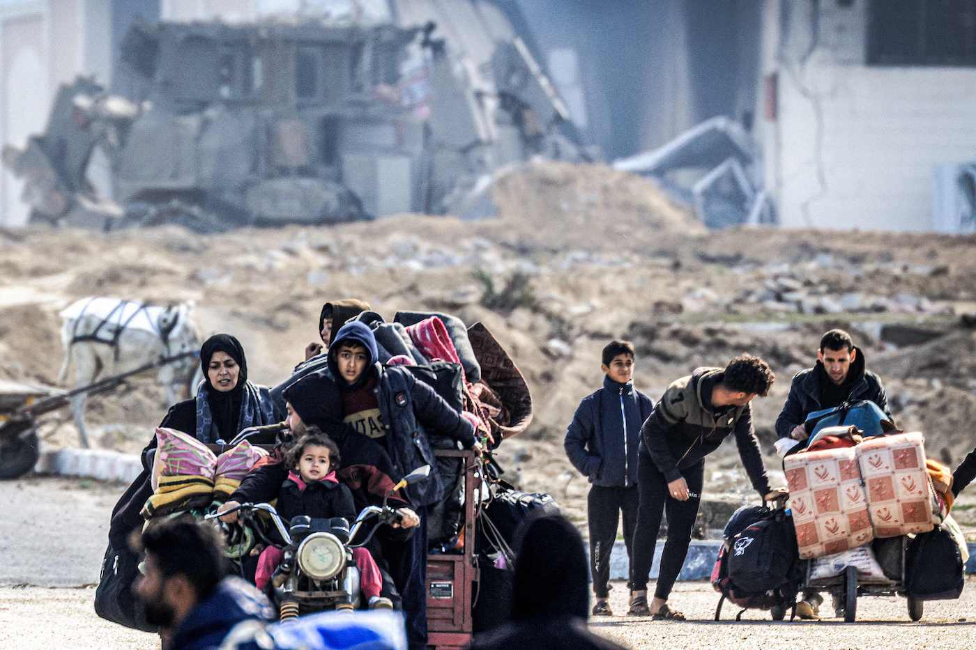 Displaced Palestinians flee from Khan Yunis in the southern Gaza Strip on January 30, 2024. (AFP)