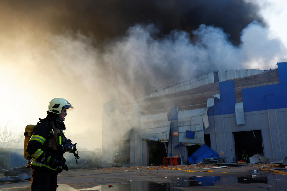 A firefighter works at a site of a warehouse heavily damaged during a Russian missile strike, amid Russia's attack on Ukraine, in Kyiv, Ukraine December 29, 2023. (REUTERS)