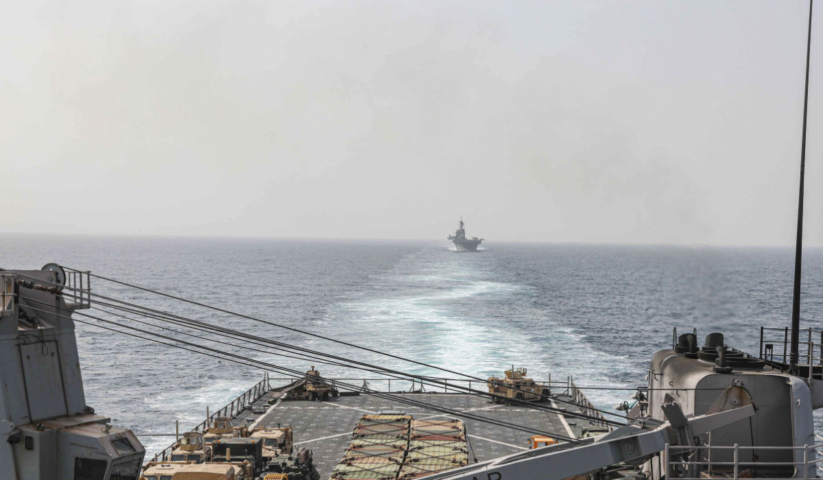 In this image provided by the U.S. Navy, the amphibious dock landing ship USS Carter Hall and amphibious assault ship USS Bataan transit the Bab al-Mandeb strait on Aug. 9, 2023. (AP)