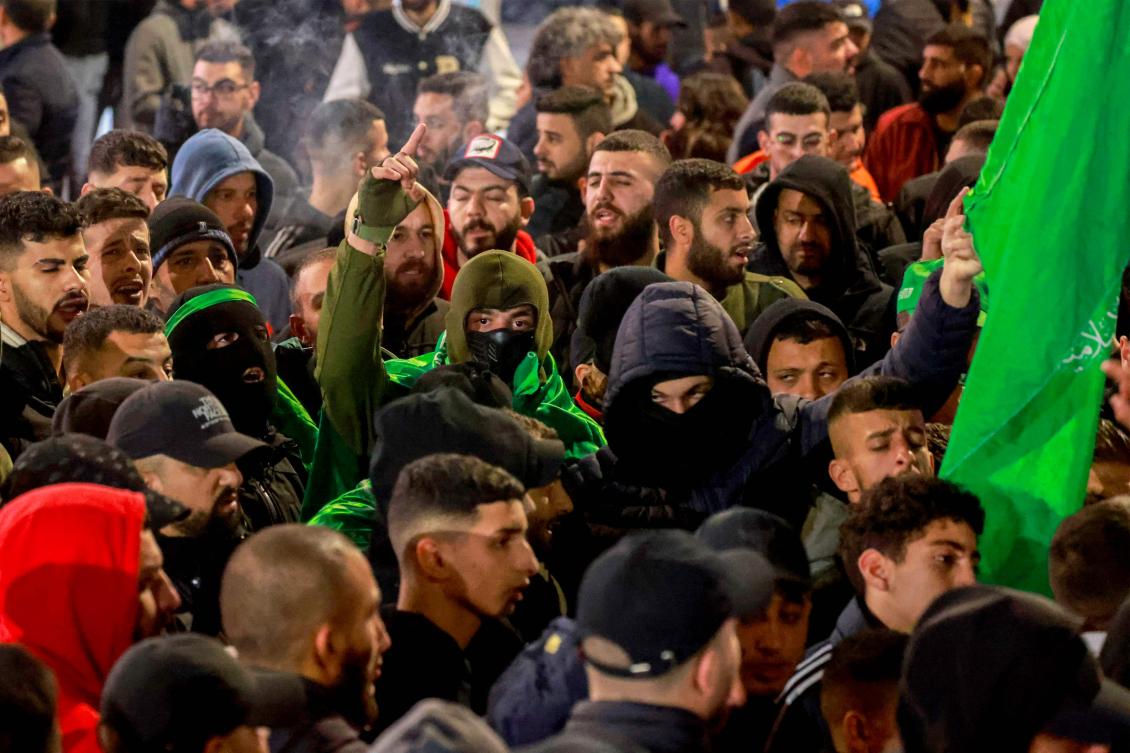 Palestinian Hamas suporters in the West Bank city of Ramallah protested on Jan. 2, 2024, against the Israeli strike in Lebanon that killed Hamas’ deputy leader Saleh Al-Aruri earlier. (AFP)