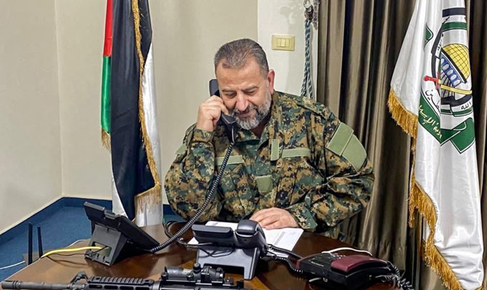 Hamas' deputy chief Saleh Al-Arouri speaking on a phone at an office in Beirut. Arouri was killed on January 2 along with his bodyguards in a strike by Israel, which has vowed to destroy Hamas after the movement's shock October 7 attacks. (AFP)