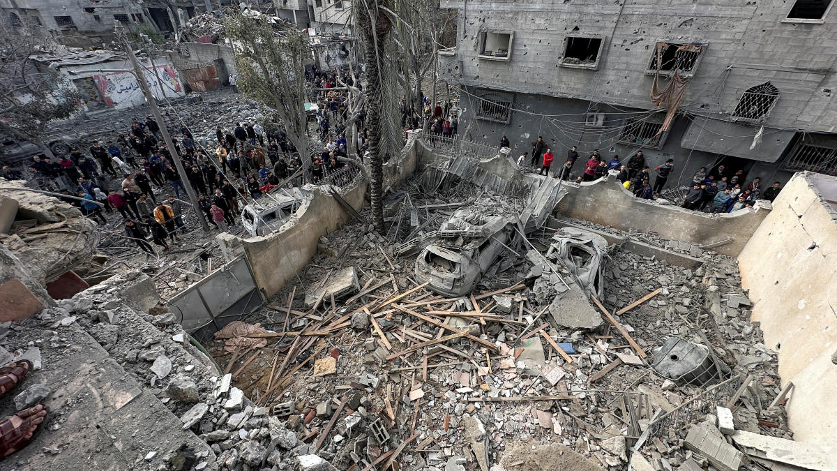 Palestinians inspect the site of an Israeli strike on a house, amid the ongoing conflict between Israel and Hamas, in Jabalia in the northern Gaza Strip, January 3, 2024. (Reuters)