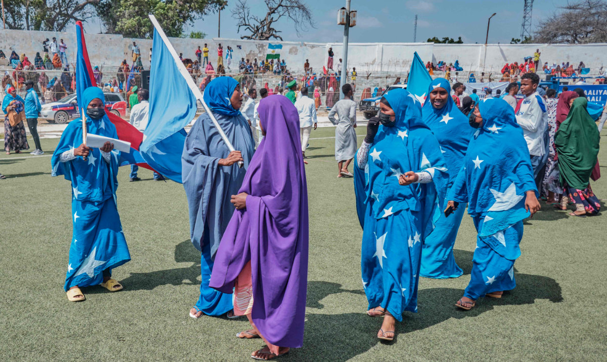Girls dressed in the colors of the Somali flag participate in a demonstration supporting Somalia following the port deal signed between Ethiopia and the breakaway region of Somaliland, in Mogadishu on Thursday. (AFP)