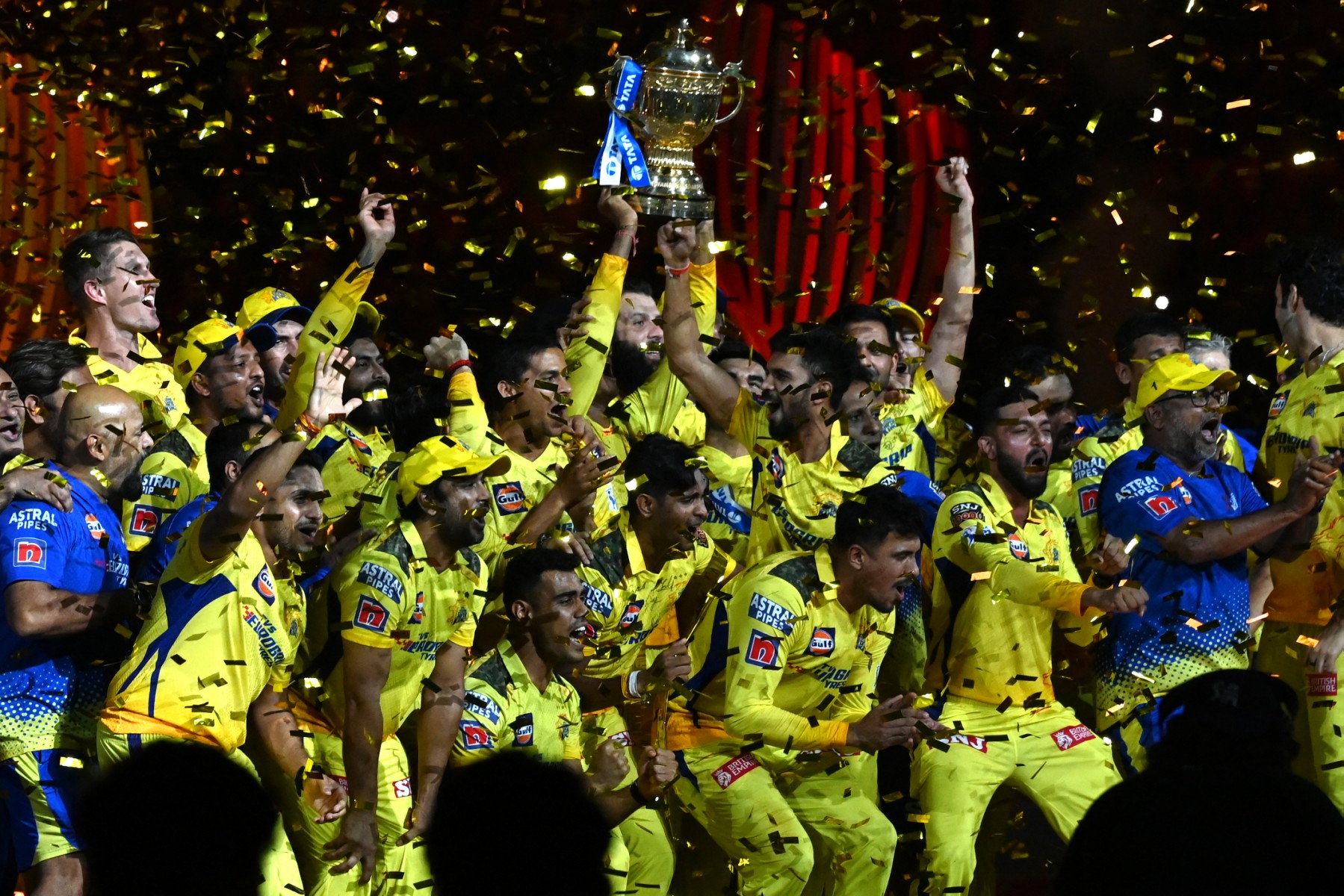 Chennai Super Kings' players celebrate with the trophy after their victory against Gujarat Titans in the Indian Premier League (IPL) Twenty20 final cricket match at the Narendra Modi Stadium in Ahmedabad on May 30, 2023