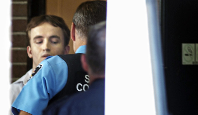 Nathaniel Veltman is escorted while leaving trial outside Ontario Superior Court in Windsor, Ontario, Tuesday, Sept.5, 2023. (AP)