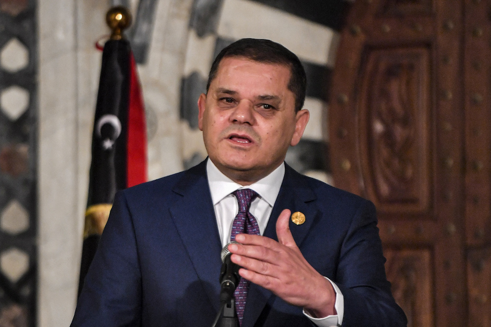 Libya’s Tripoli-based Prime Minister Abdul Hamid Dbeibah gives a press conference in Tunisia. (File/AFP)