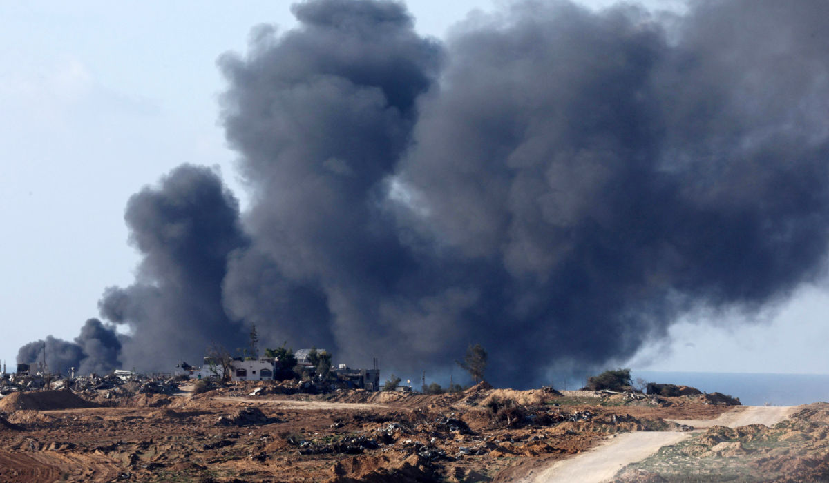 A picture taken from a position in southern Israel along the border with the Gaza Strip, shows smoke billowing over the Palestinian territory during Israeli bombardment on January 5, 2024, amid continuing battles between Israel and the militant group Hamas. (AFP)