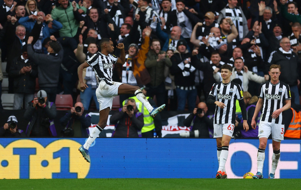 Newcastle United’s Alexander Isak celebrates scoring their third goal with Lewis Miley and Sean Longstaff. (Action Images via Reuters)