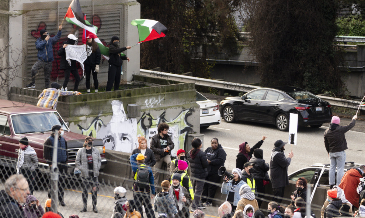 Protesters calling for a cease-fire in the Israel-Hamas war block Interstate 5 northbound, Saturday, Jan. 6, 2024 in downtown Seattle. (AP)