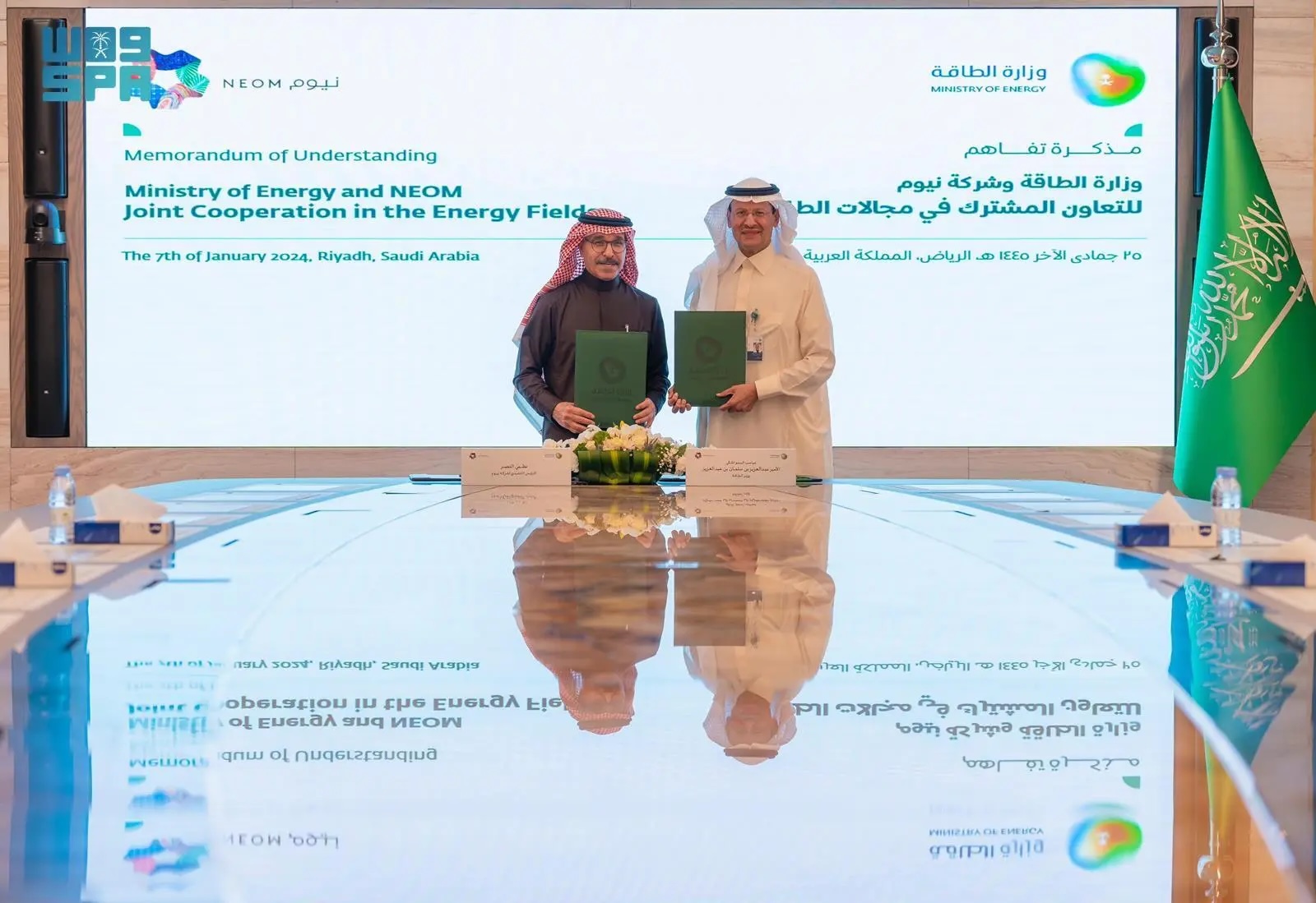 Saudi Energy Minister Prince Abdulaziz bin Salman, right, with NEOM CEO Nadhmi Al-Nasr after signing a memorandum of understanding. SPA