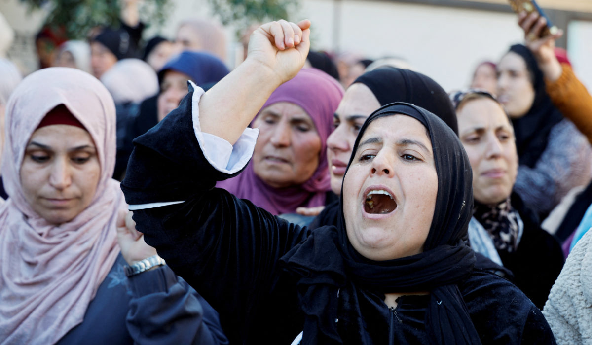 Women attend a funeral of Palestinians who were killed in an Israeli airstrike in Jenin in the Israeli-occupied West Bank on Sunday amid the ongoing conflict between Israel and Hamas. (Reuters)