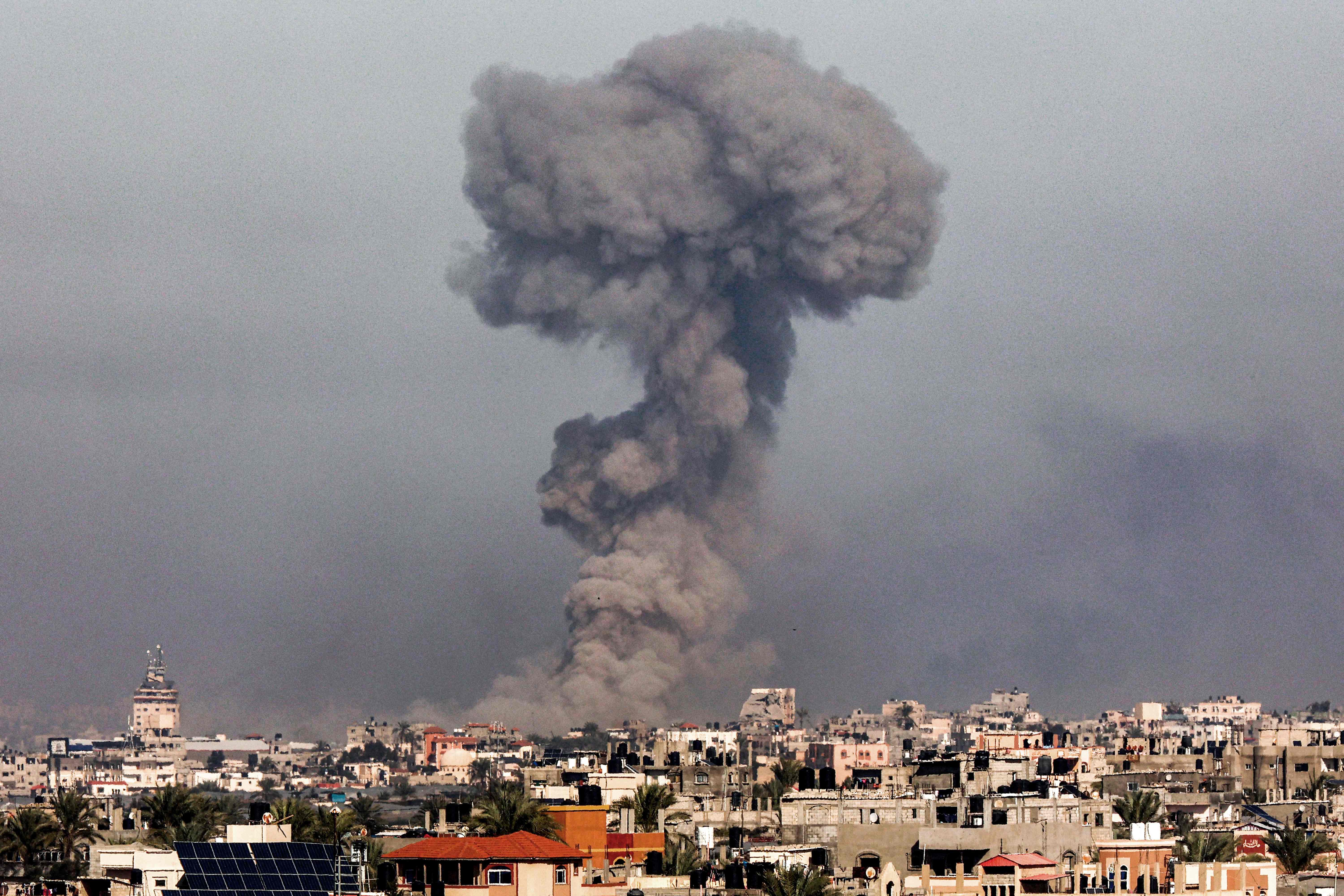 Smoke plume erupts over Khan Yunis from Rafah in the southern Gaza strip during Israeli bombardment on January 8, 2024 amid the ongoing conflict between Israel and the Palestinian Hamas militant group. (AFP)