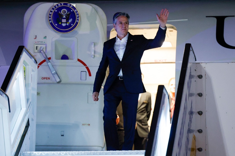 US Secretary of State Antony Blinken gestures as he arrives in Tel Aviv. (AFP)