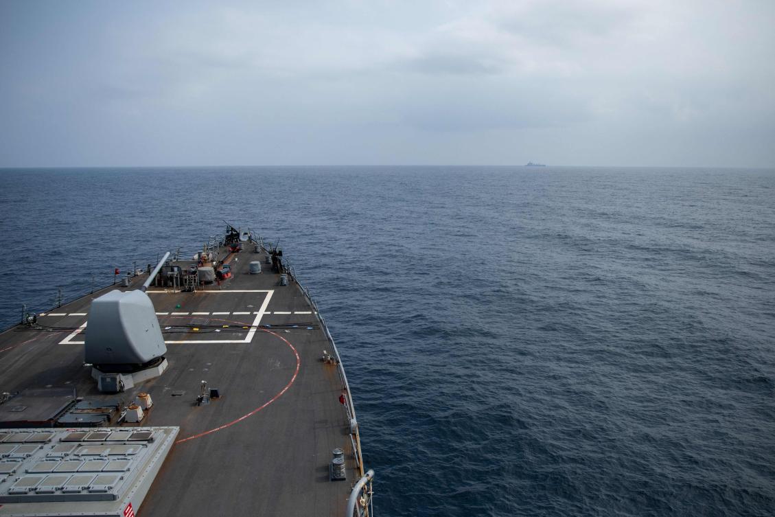In this image obtained fro the US Department of Defense, the Arleigh Burke-class guided-missile destroyer USS Laboon approaches the oiler USNS Kanawha (background) for replenishment-at-sea operation in the Red Sea on December 25, 2023. (AFP)