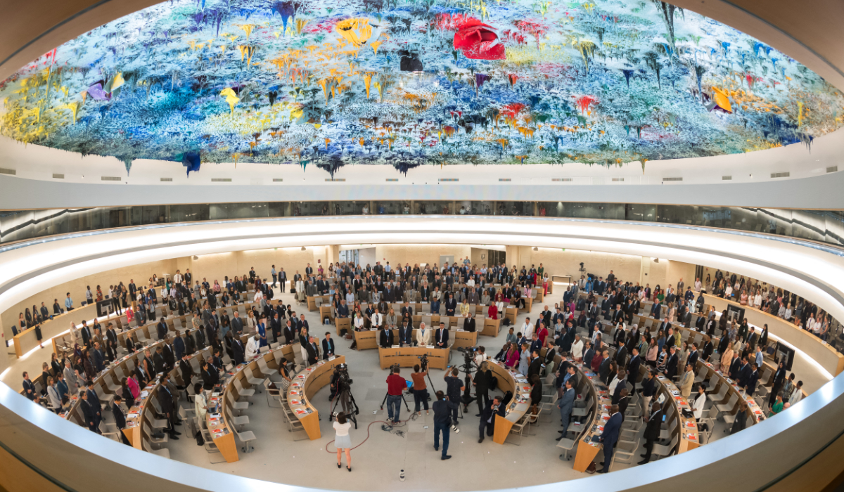 Delegates stand for a minute of silence following the deadly 6.8-magnitude September 8 earthquake, in central Morocco, at the opening of the 54th UN Human Rights Council in Geneva, on September 11, 2023. (AFP)