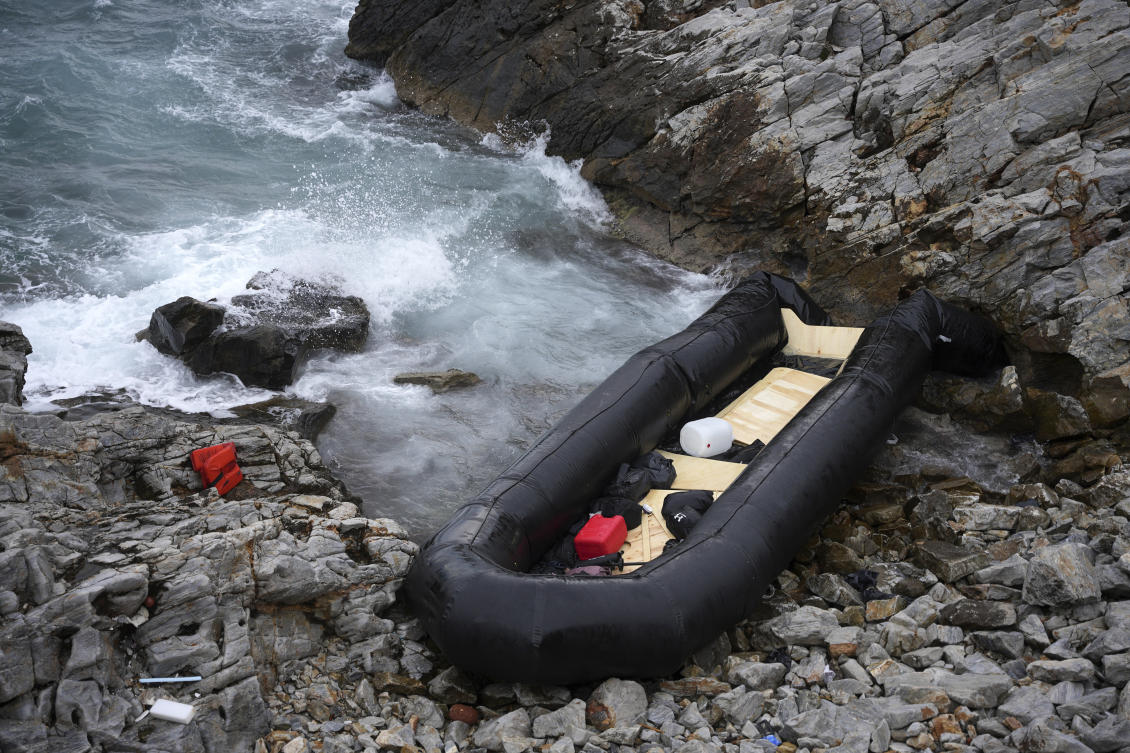 Two migrants were killed and eight were rescued in Greece Wednesday after a dinghy crashed into rocks in high winds on the island of Lesbos, local authorities said. (AP Photo/Panagiotis Balaskas)