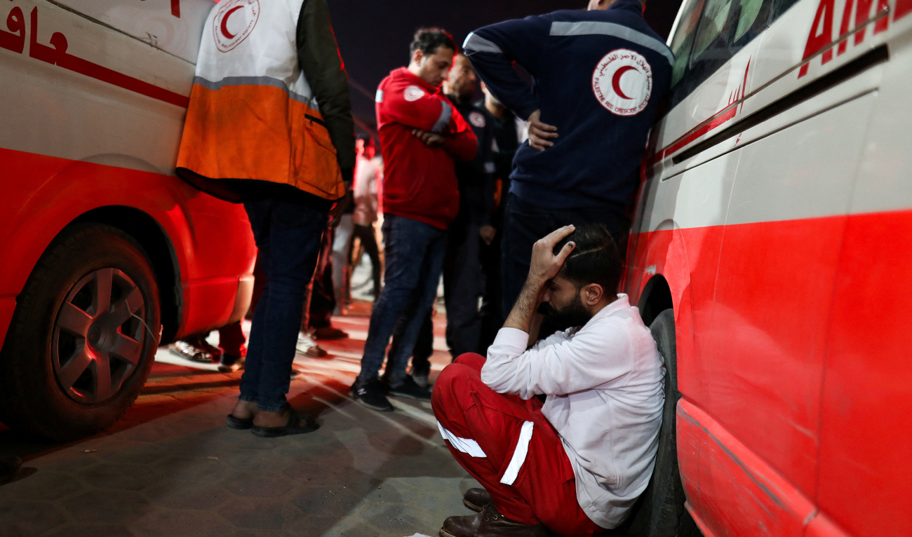 A Palestinian medic reacts after several members of the Palestinian Red Crescent were killed when an Israeli strike hit an ambulance, according to the Red Crescent, in Deir al-Balah, in the central Gaza Strip January 10, 2024. (REUTERS)