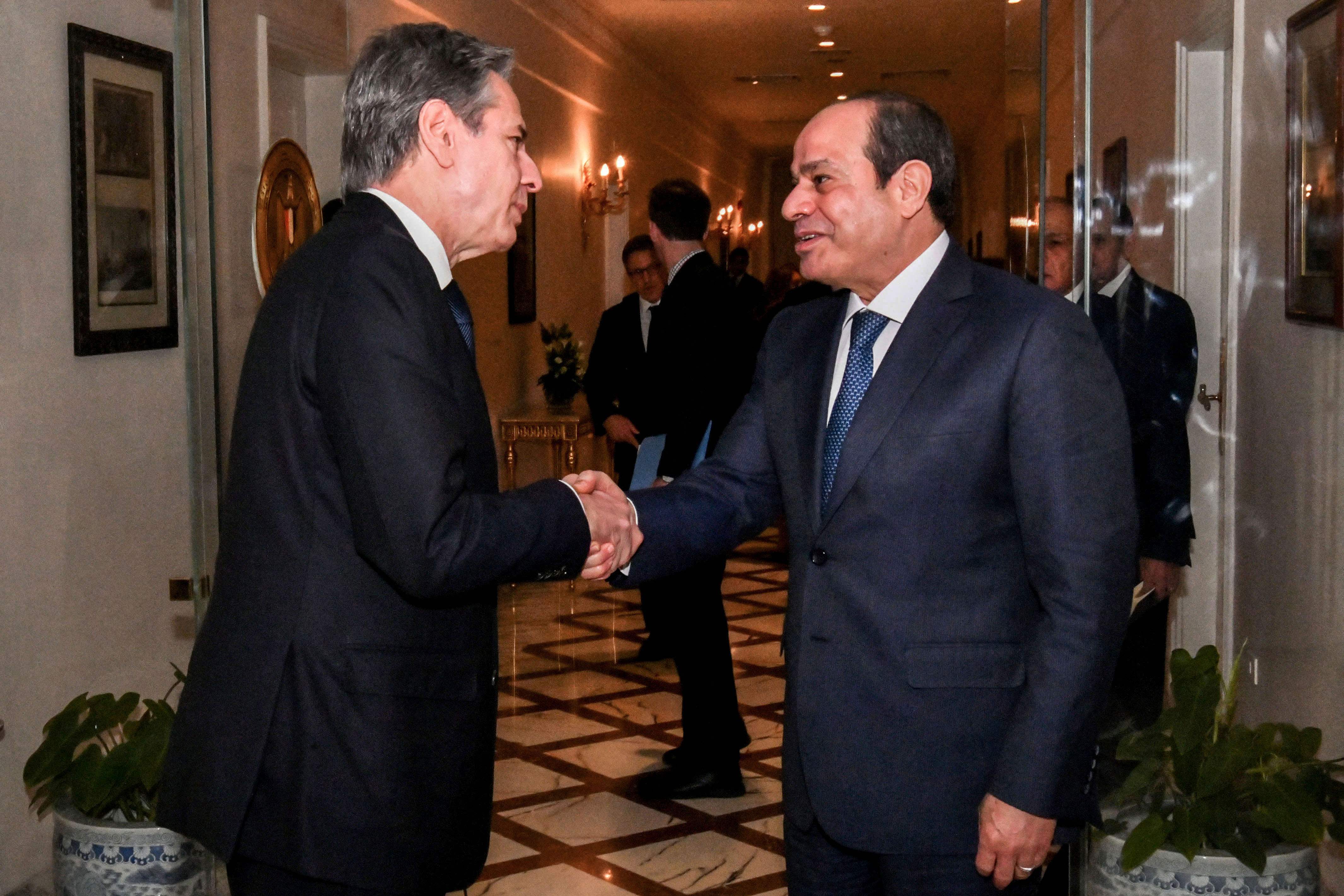 A handout picture released by the Egyptian Presidency shows Egyptian president Abdel Fattah El-Sisi (R) meeting with US Secretary of State Antony Blinken in Cairo at the Ittihadia presidential Palace on January 11, 2024. (AFP/Egyptian Presidency)