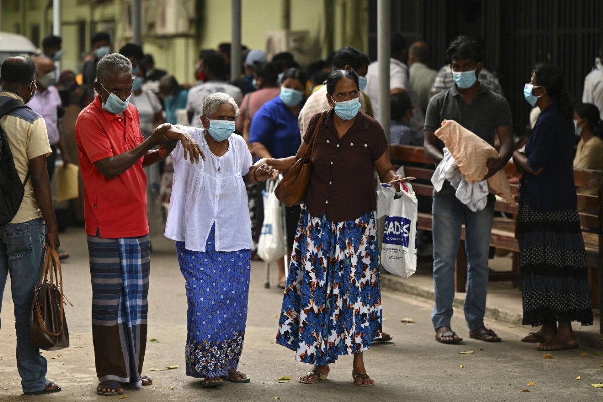 This photo taken on February 11, 2022, shows patients leaving a hospital in Colombo as Sri Lankan health workers go on strike to demand better wages and work conditions. (AFP/File)