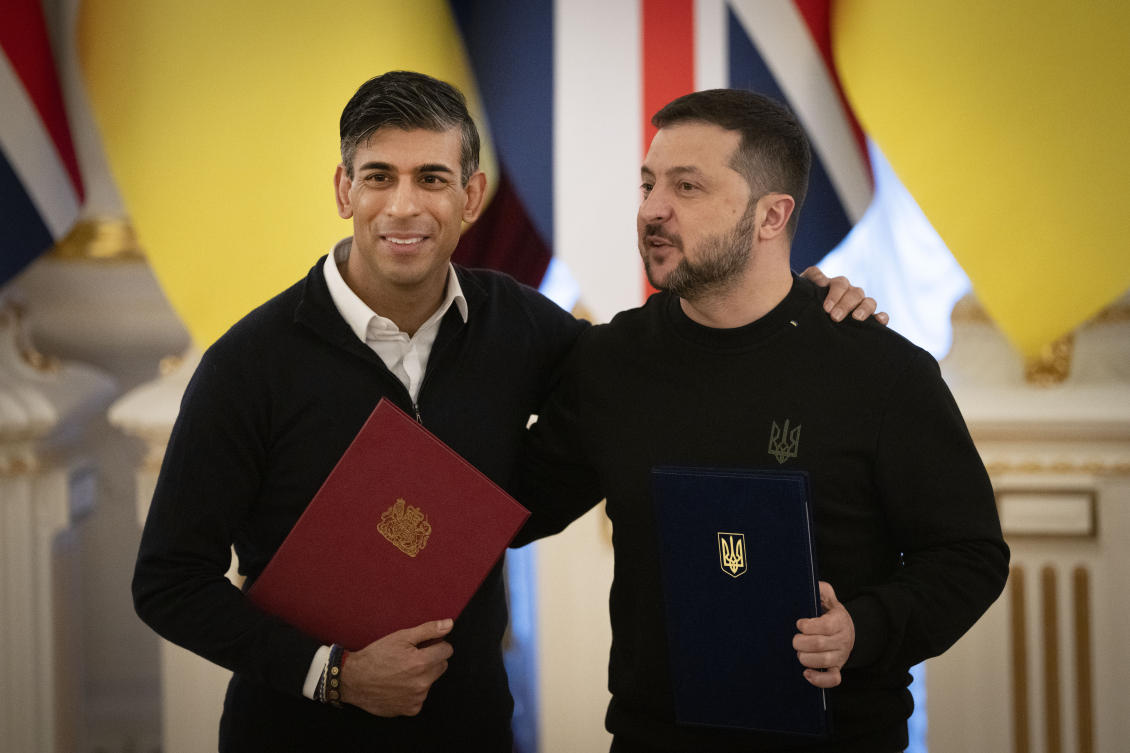 Britain’s Prime Minister Rishi Sunak hugs Ukrainian President Volodymyr Zelensky after signing documents in Kyiv on Jan. 12, 2024. (AP)