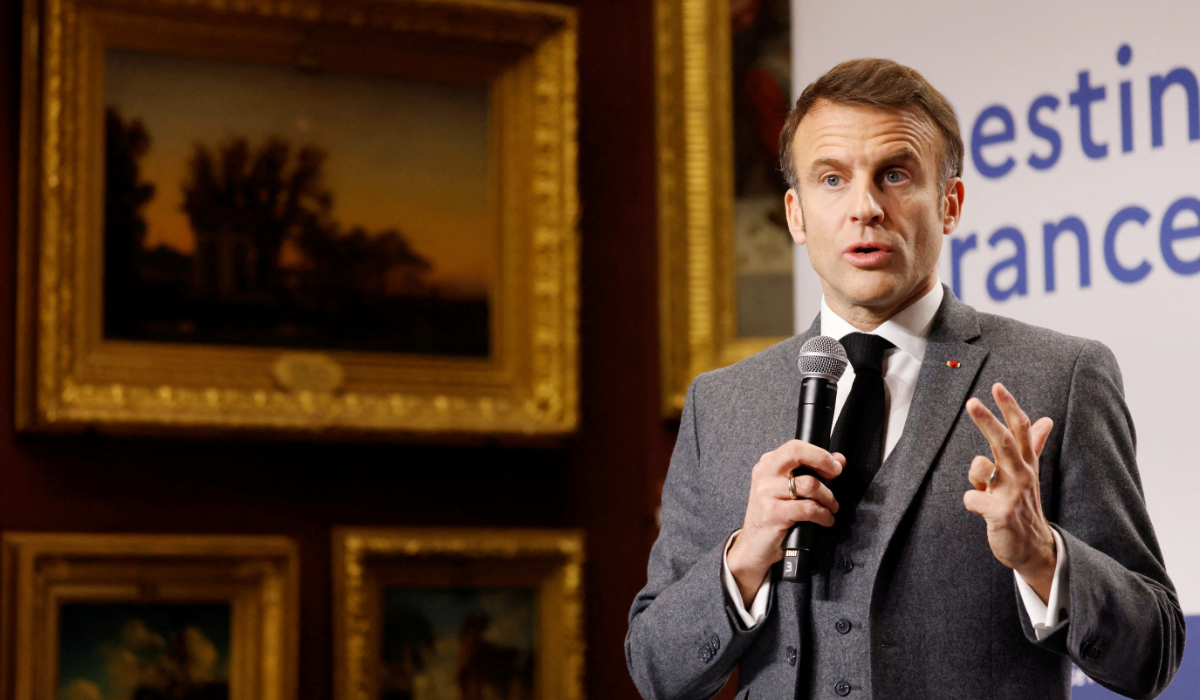 France's President Emmanuel Macron gestures as he delivers a speech on France's tourism attractions during the "Destination France" event in the historical town of Chantilly, January 11, 2024. (REUTERS)