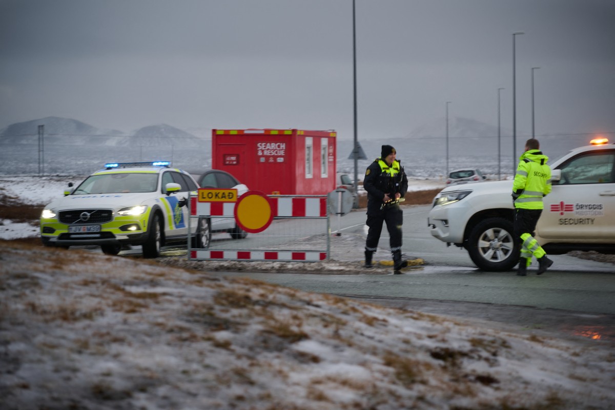 Police is seen blocking traffic towards an area of an active volcanic eruption on the Reykjanes peninsula 3 km north of Grindavik (AFP)