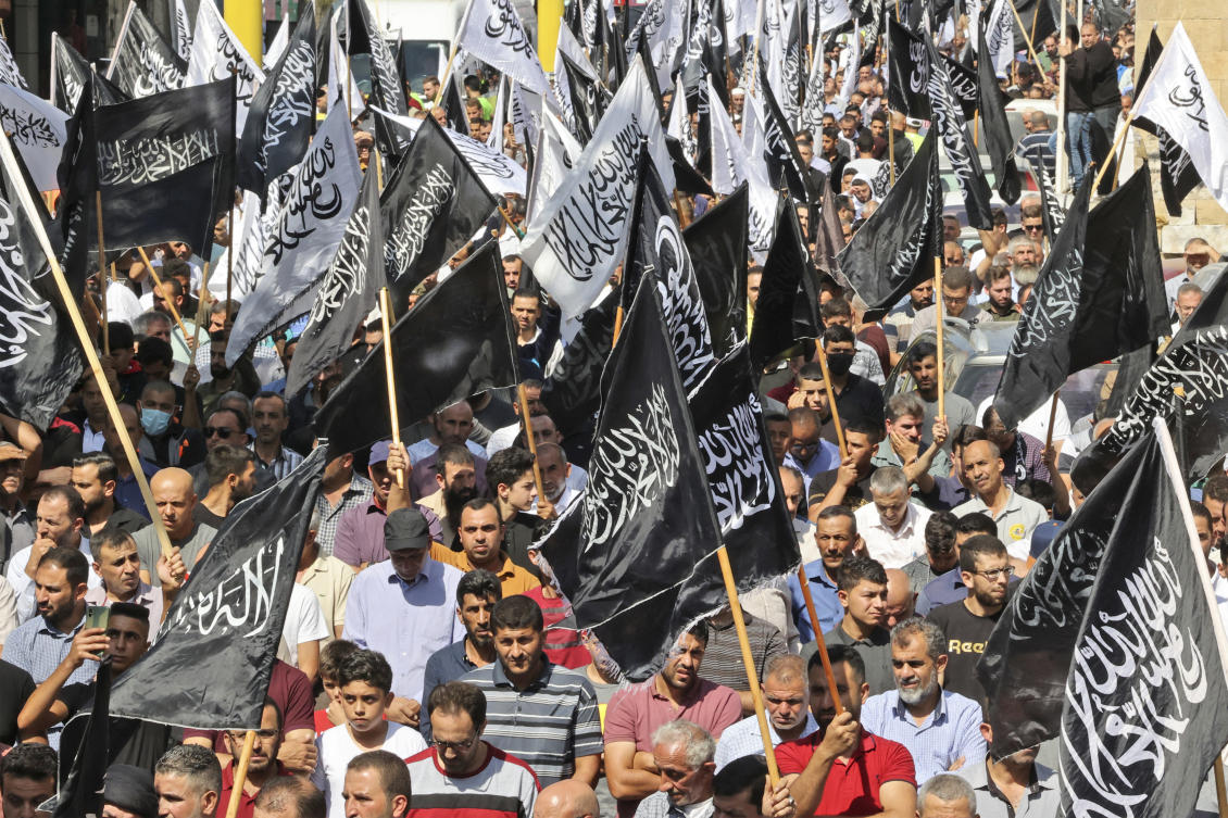 Supporters of Hizb ut-Tahrir or the Islamic Liberation Party of the Islamic Liberation Party march demanding a ban on Jewish prayer at Al-Aqsa mosque. (File/AFP)