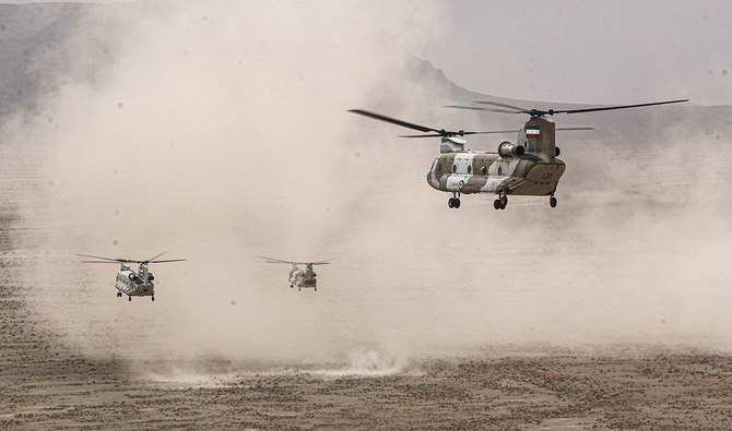 A handout picture provided by the Iranian Army media office on October 28, 2023 shows helicopters during a military drill in the Isfahan province in central Iran. (AFP/File)