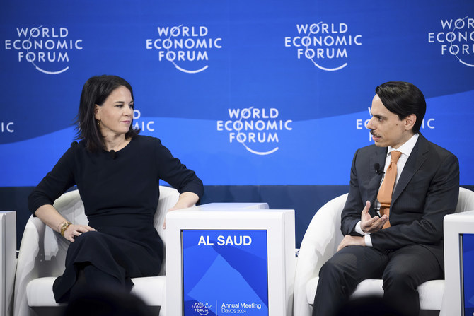 Saudi Arabia’s Foreign Minister Prince Faisal bin Farhan speaks next to Federal Minister of Foreign Affairs of Germany Annalena Baerbock during a panel session at WEF, in Davos, Switzerland. (AP)