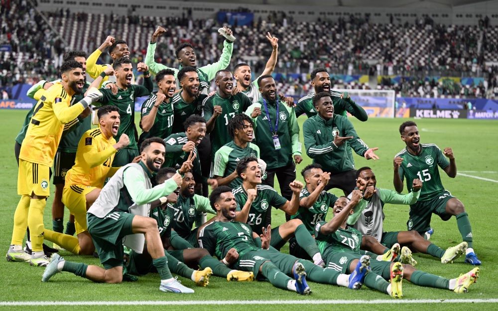 Saudi players celebrate their late win over Oman at the AFC Asian Cup in Qatar. (AN Photo/Basheer Saleh)