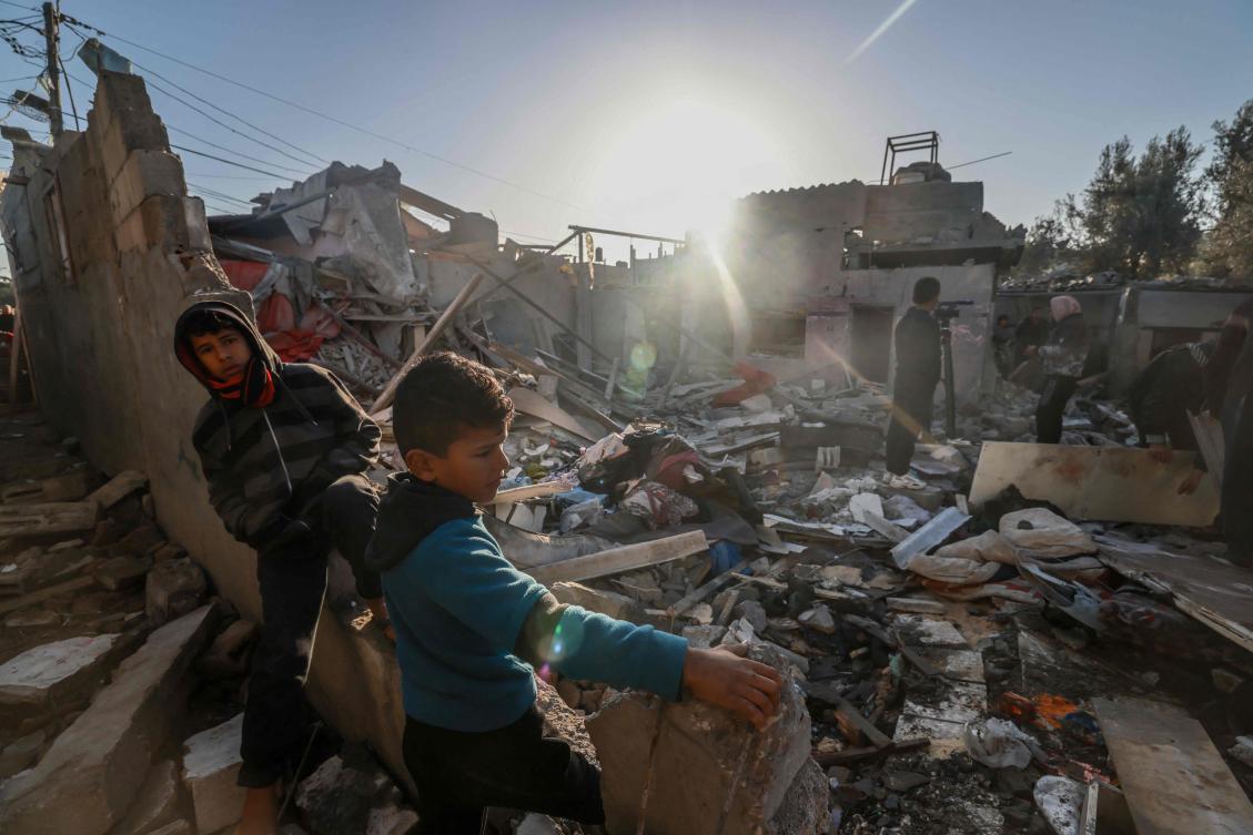 Palestinians check the rubble of a building following Israeli bombardment, on January 18, 2024 in Rafah in the southern Gaza Strip, amid ongoing battles between Israel and the Palestinian militant group Hamas. (AFP)