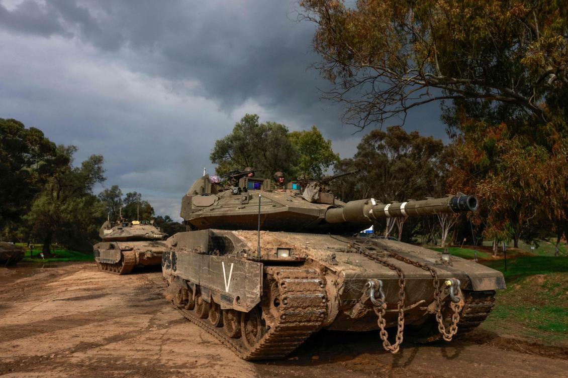 An Israeli armored vehicle convoy returns from the Gaza Strip on January 15, 2024, amid ongoing battles between Israel and the Palestinian Hamas militant group. (AFP)
