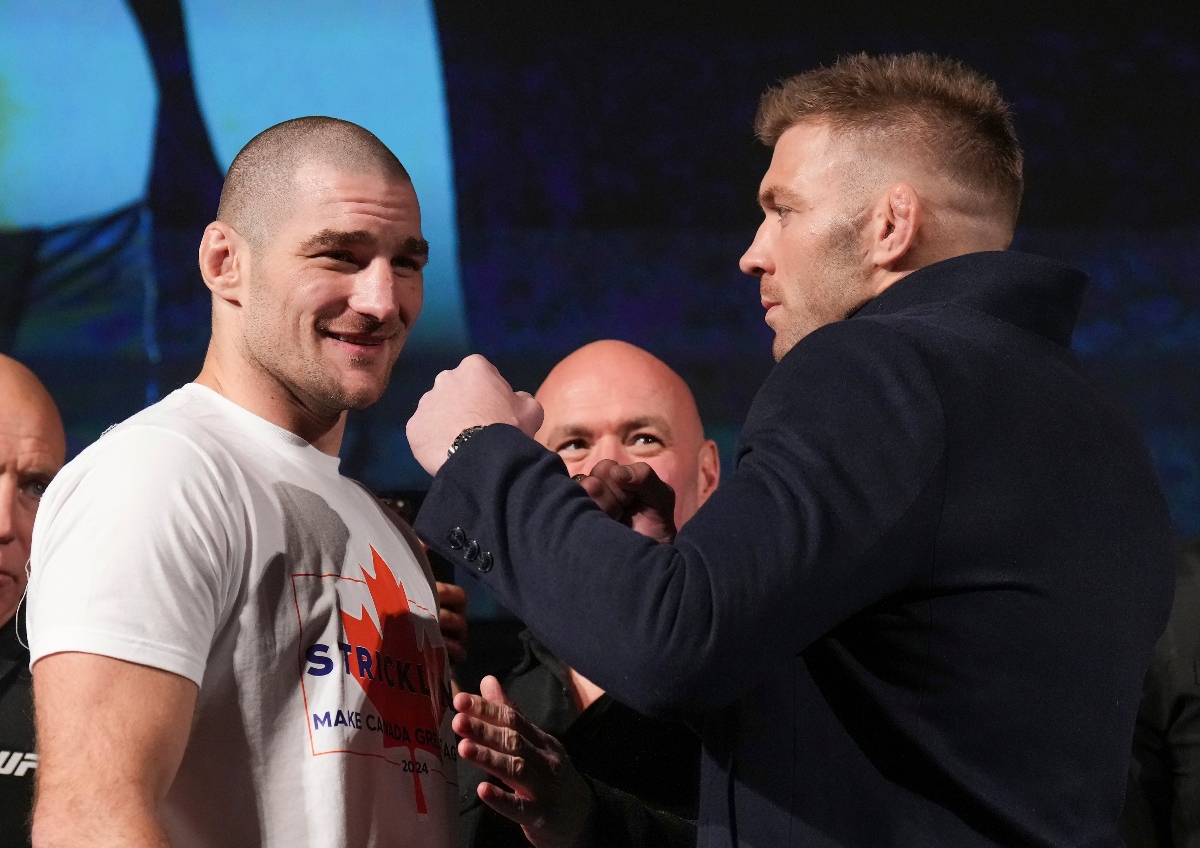 Sean Strickland, left, UFC middleweight champion, and Dricus Du Plessis, right, face off after holding a mixed martial arts news conference ahead of UFC 297 in Toronto, Thursday. (The Canadian Press via AP)