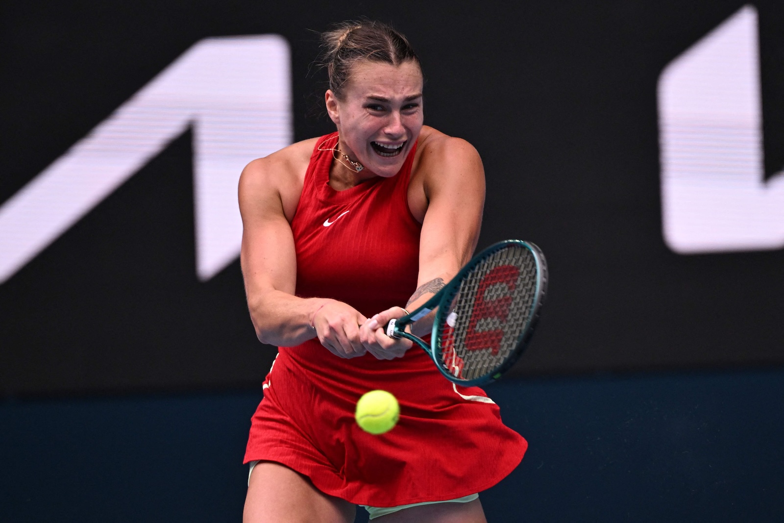 Belarus' Aryna Sabalenka hits a return against Ukraine's Lesia Tsurenko during their women's singles match on day six of the Australian Open tennis tournament in Melbourne on Jan. 19, 2024. (AFP)