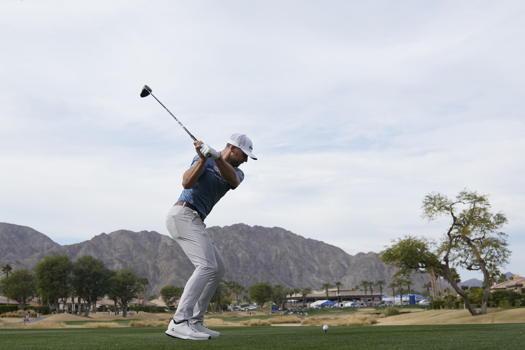 Sam Burns hits from the 18th tee at the Nicklaus Tournament Course at PGA West during the second round of the American Express golf tournament Friday in La Quinta, Calif. (AP)
