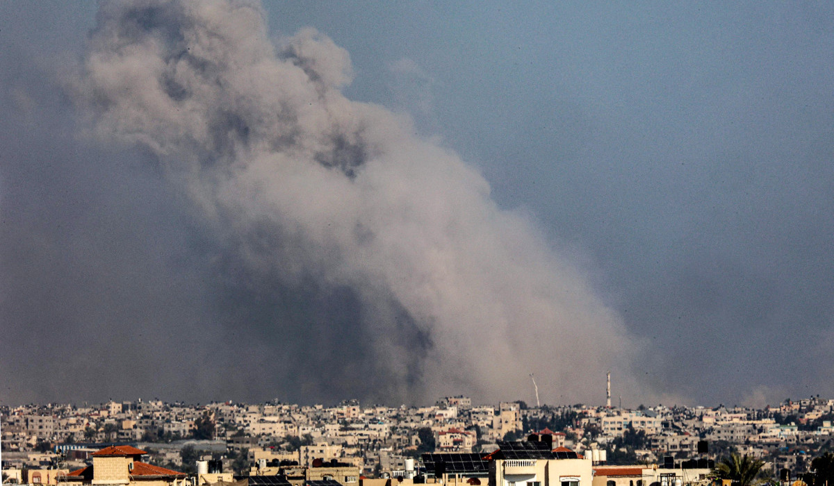 A picture taken from Rafah shows smoke billowing over Khan Yunis in the southern Gaza Strip during Israeli bombardment on January 20, 2024, amid ongoing battles between Israel and the Palestinian militant group Hamas. (AFP)