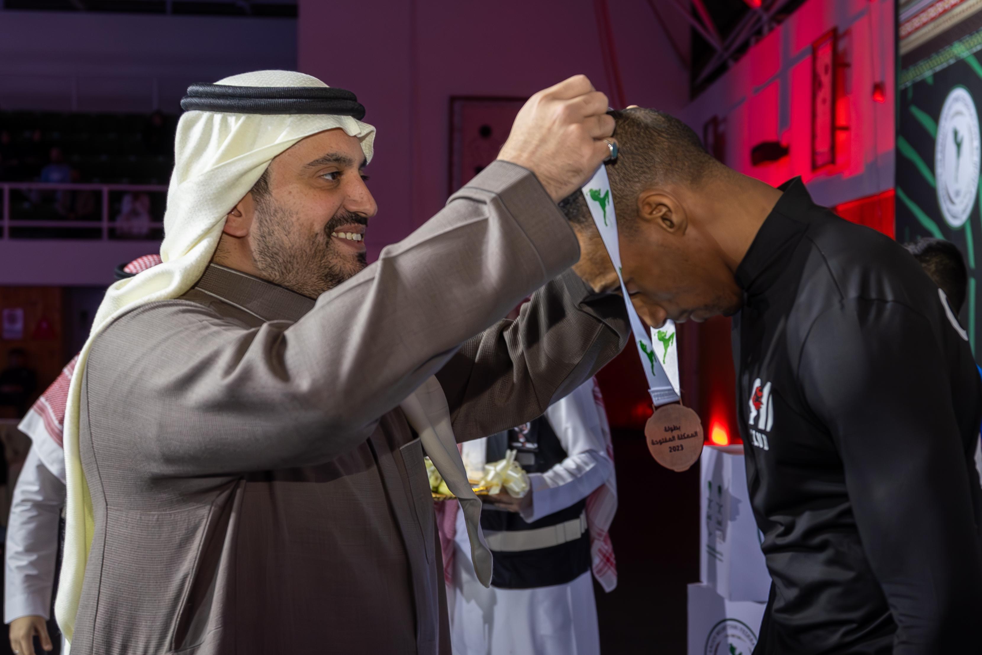 Prince Fahd bin Jalawi crowns a medalist at the Open Kingdom Championship 2023 in Riyadh. (Supplied)