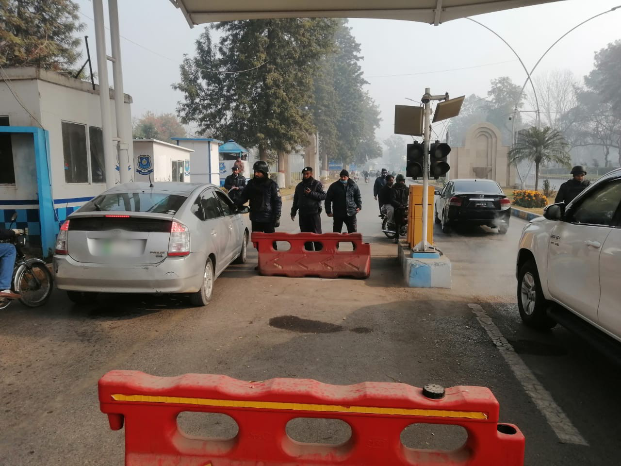 Police officers stand guard by a check point in Islamabad. (Supplied)