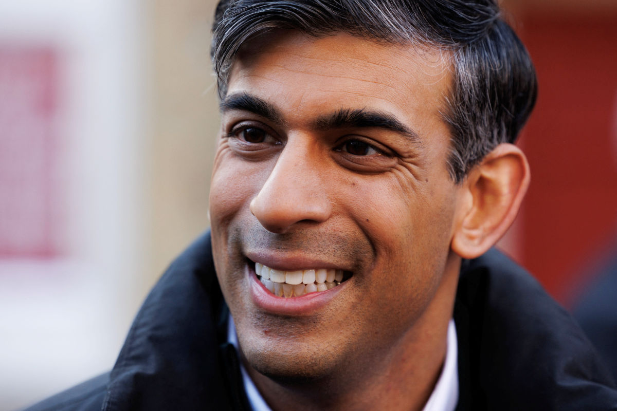 Britain's Prime Minister Rishi Sunak speaks to members of the public while walking down the high street during a visit to Winchester, Britain January 19, 2024. (REUTERS)