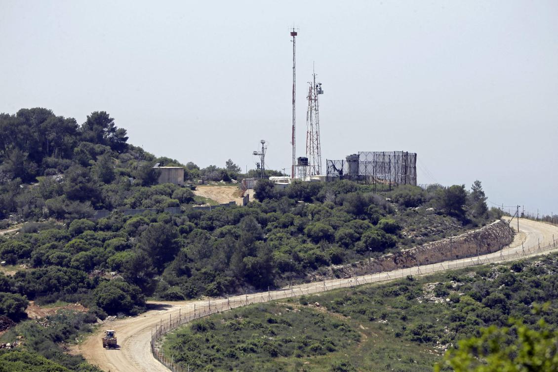 A picture taken from Naqoura in southern Lebanon shows an Israeli observation station along the border near Kibbutz Hanita on April 20, 2017. (AFP)