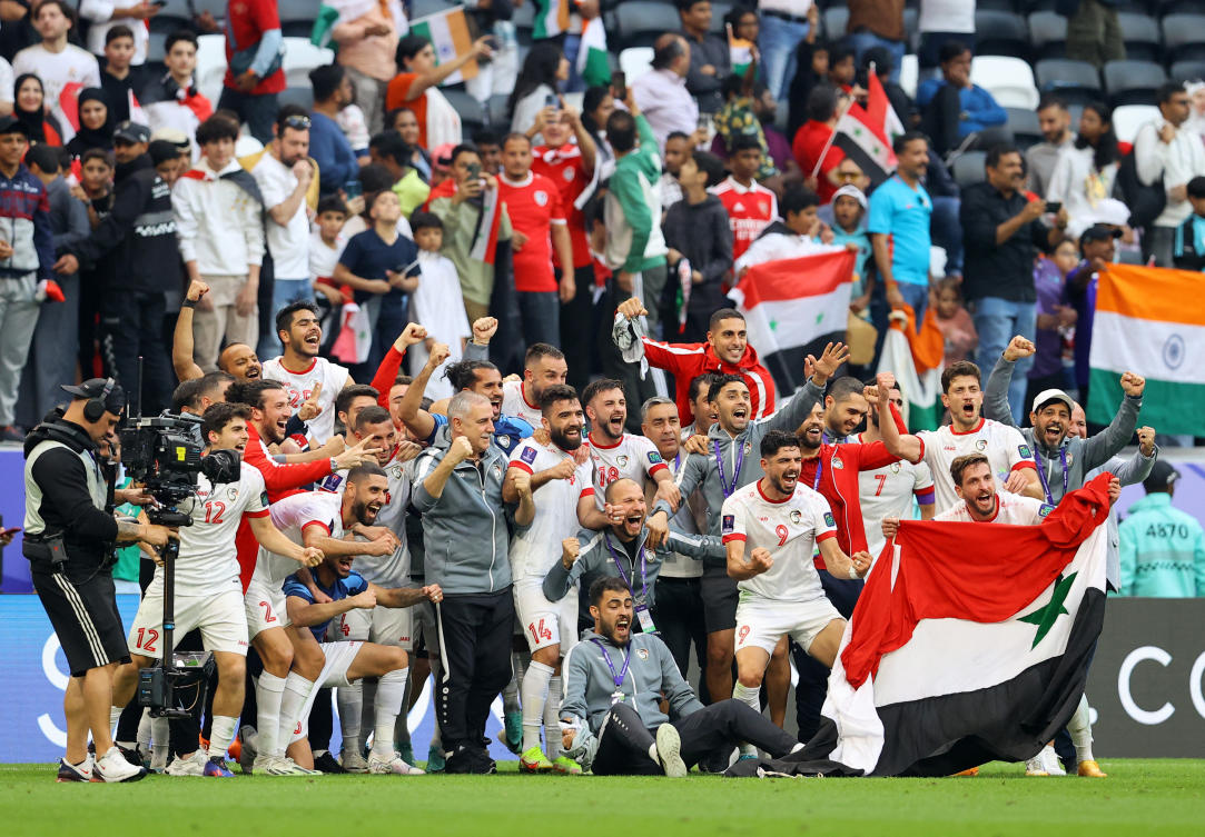 Syria players celebrate after their AFC Asian Cup — Group B — match against India at Al Bayt Stadium, Al Khor, Qatar on Jan., 23, 2024. (Reuters)