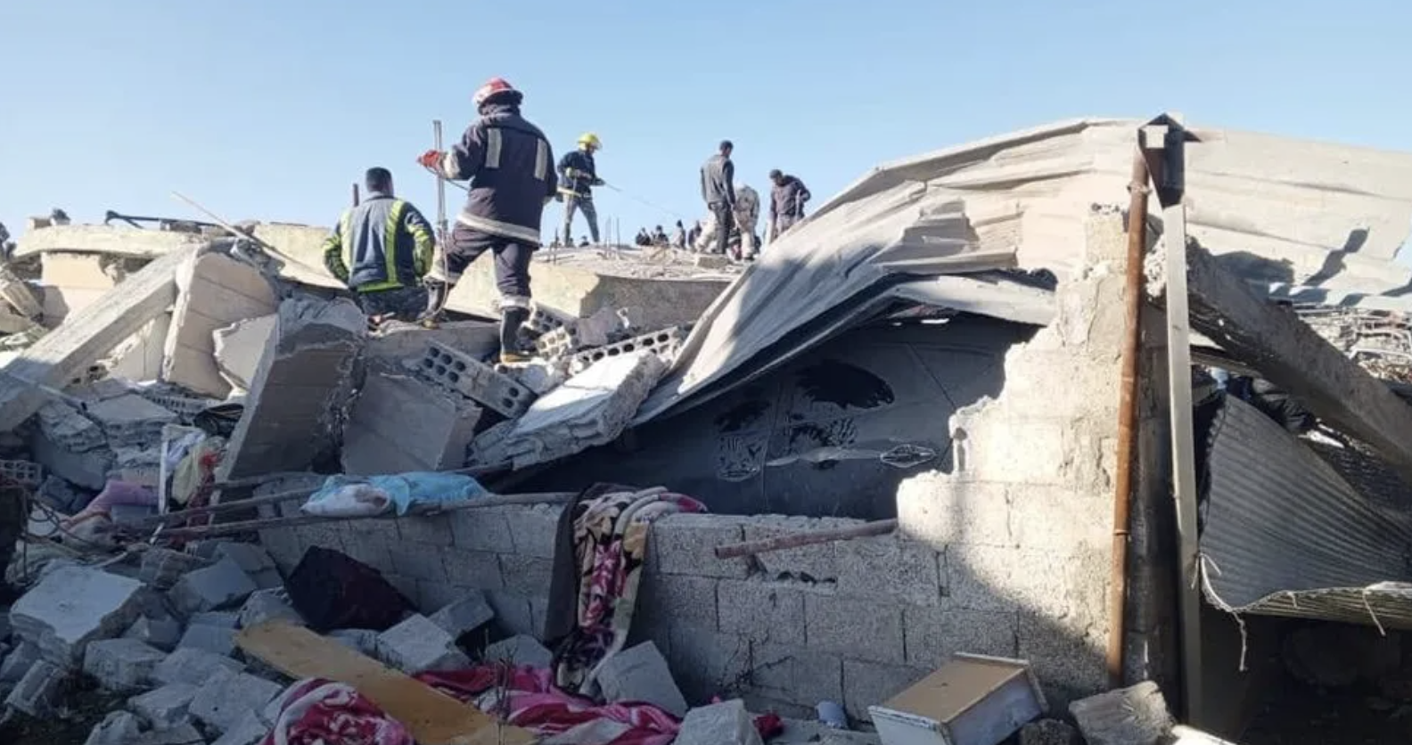 Rescuers search for people presumed dead after the Jordanian strikes in Arman. (Suweida Fire Brigade)