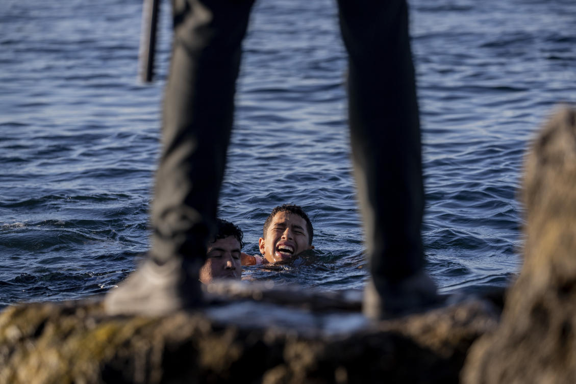 A Spanish civil guard waits for migrants to arrive at the Spanish enclave of Ceuta, near the border of Morocco and Spain, on May 19, 2021. (AP/File)