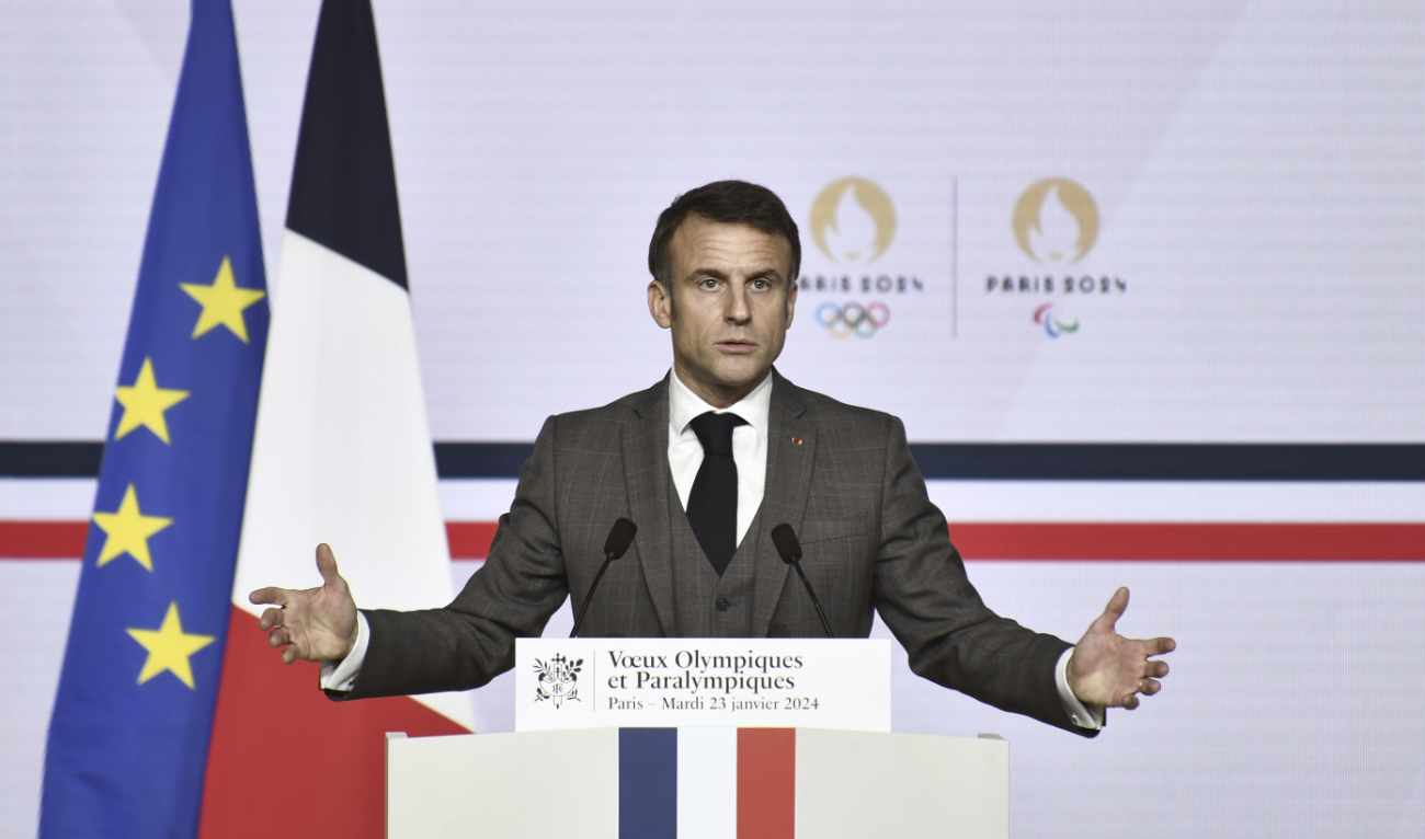 French President Emmanuel Macron delivers a speech to present his New Year's wishes to elite athletes ahead of the Paris 2024 Olympic and Paralympic Games, at France's National Institute of Sport, Expertise, and Performance (INSEP) in Paris, Tuesday. (AP)