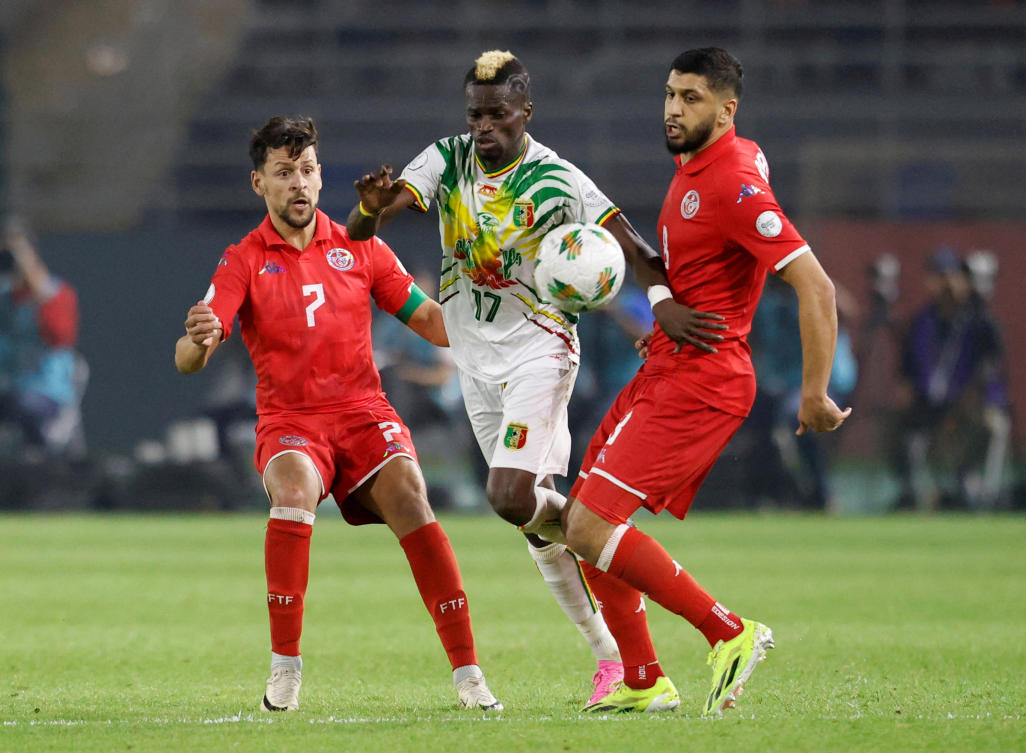 Mali's Falaye Sacko in action with Tunisia's Youssef Msakni during their Africa Cup of Nations - Group E - match at Stade Amadou Gon Coulibaly, Korhogo, on Jan. 20, 2024. (Reuters)