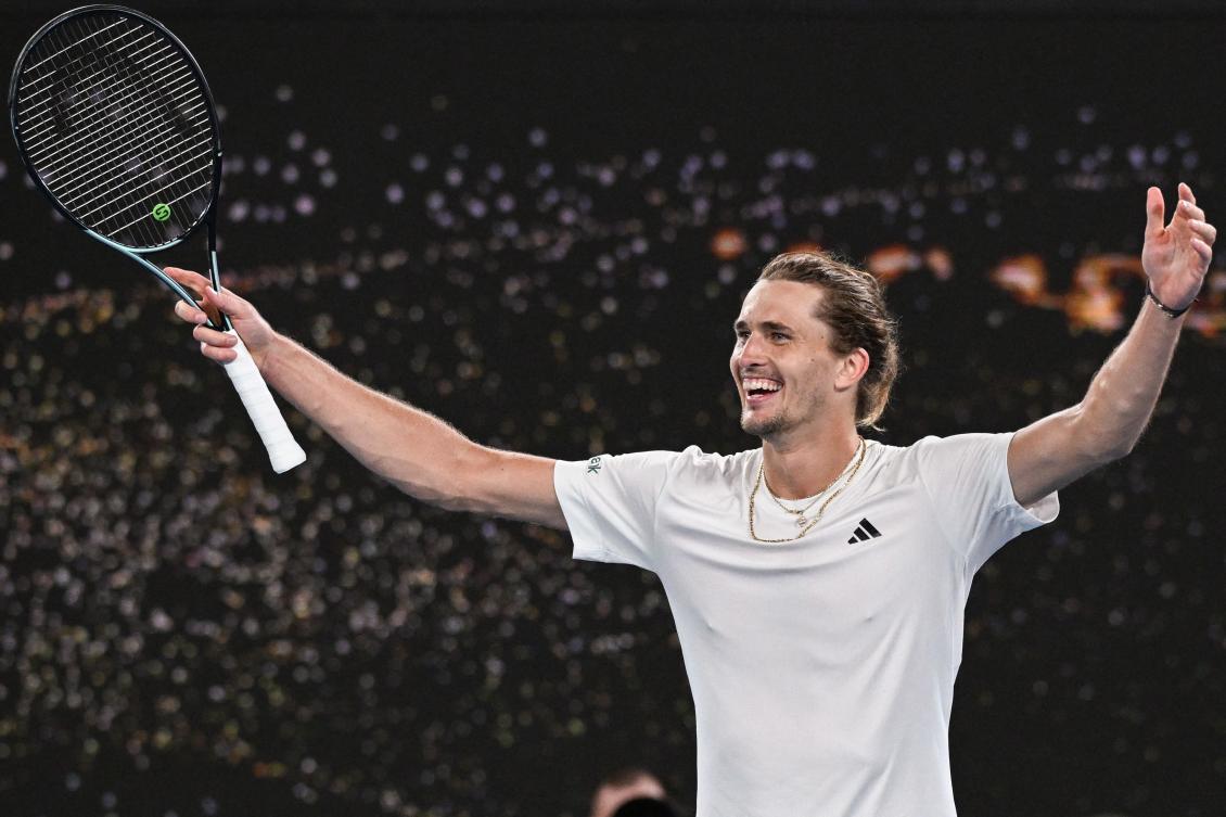 Germany’s Alexander Zverev celebrates after victory against Spain’s Carlos Alcaraz during their men’s singles quarter-final match on day 11 of the Australian Open tennis tournament in Melbourne on Jan. 25, 2024. (AFP)