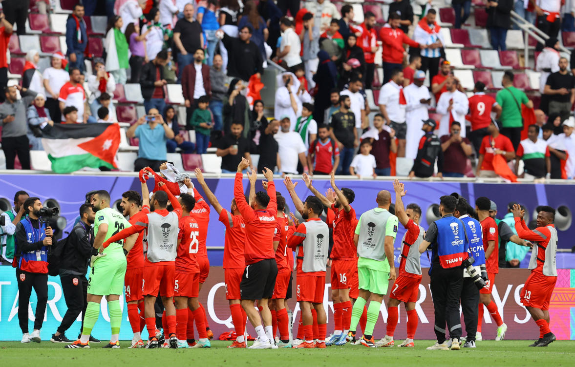 Bahrain players celebrate after their AFC Asian Cup — Group E match against Jordan at Khalifa International Stadium, Al Rayyan, on Jan. 25, 2024. (Reuters)