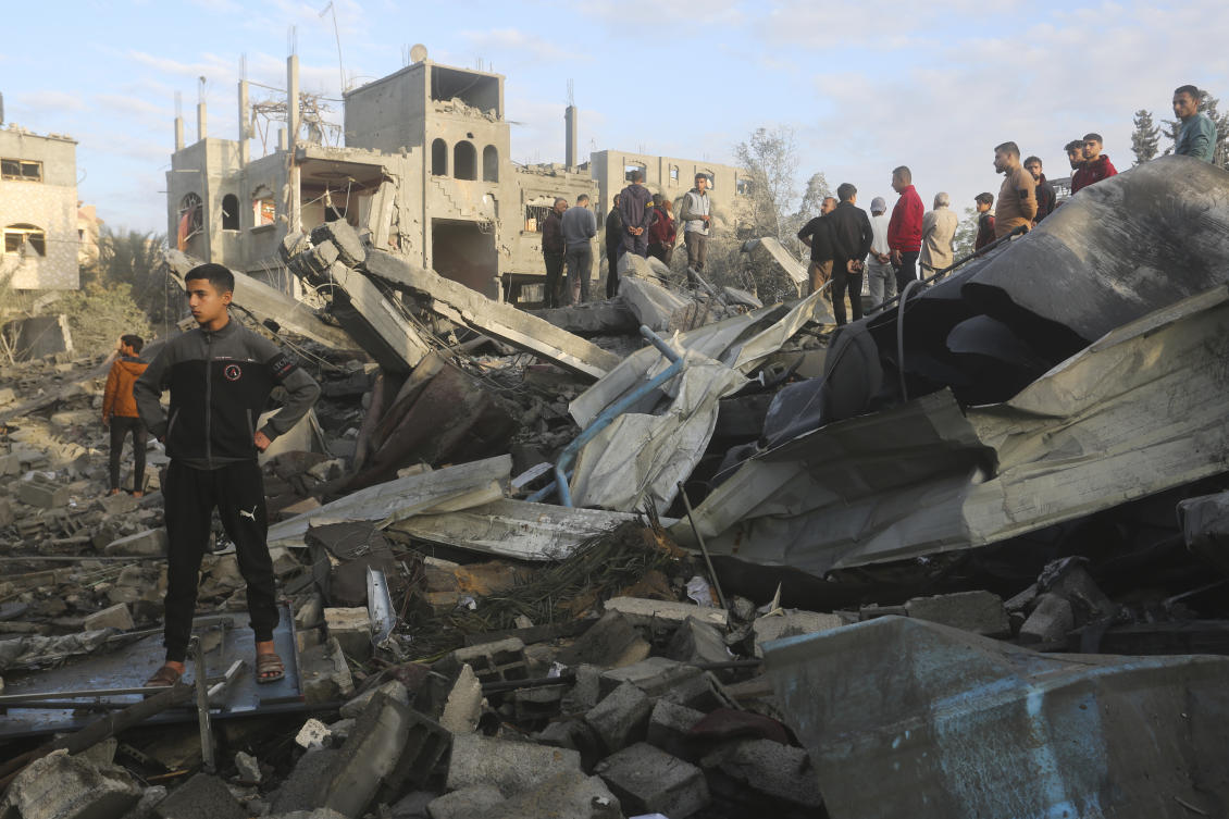 Palestinians look at a mosque destrooyed in an Israeli strike in Rafah, Gaza Strip. on Jan. 24, 2024. (AP)