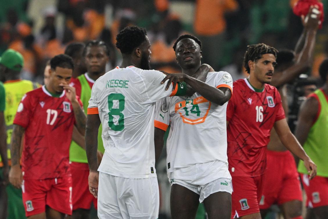Ivory Coast’s midfielder Franck Kessie consoles teammate Oumar Diakite after Equatorial Guinea won their Africa Cup of Nations (CAN) 2024 group A match at the Alassane Ouattara Olympic Stadium in Ebimpe, Abidjan on Jan. 22, 2024. (AFP)